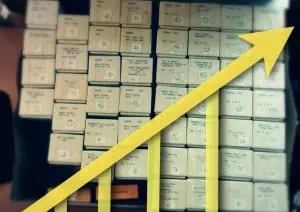 Boxes of slides with rising graph on top - Scanning Progress Report