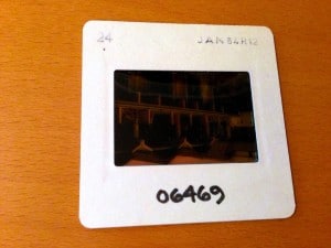 35mm slide on desk — showing exposure number and date markings at top