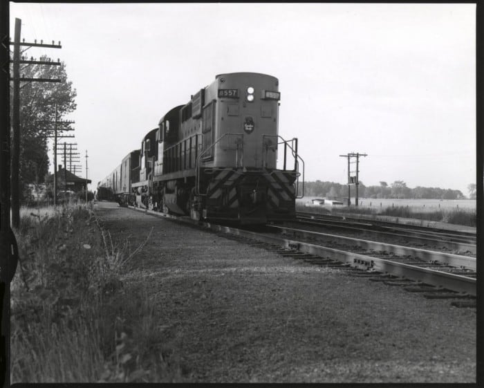 4 x 5" contact print of CPR 8557 and train departing Locust Hill, Ontario, on a summer evening